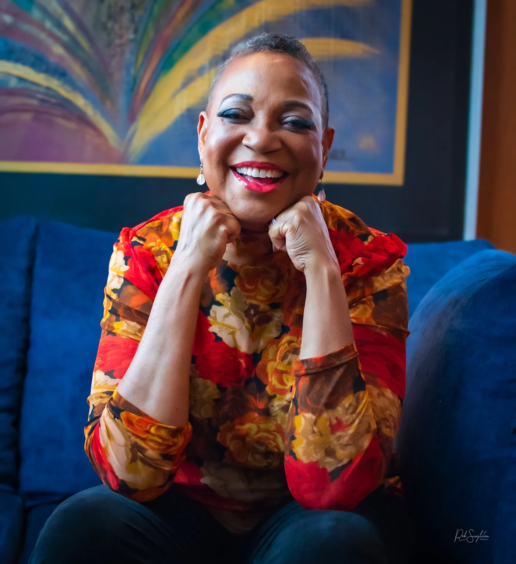 Dr. Karen Williams smiling in a colorful portrait