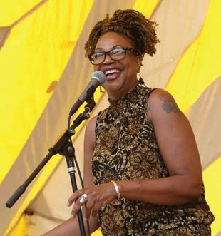 Karen Williams speaking at a podium